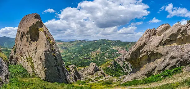 Panoramic view of the famous Lucan Dolomites with beautiful mountain village of Castelmezzano, one of 'The most beautiful villages in Italy' from Pietrapertosa in Basilicata, Italy
