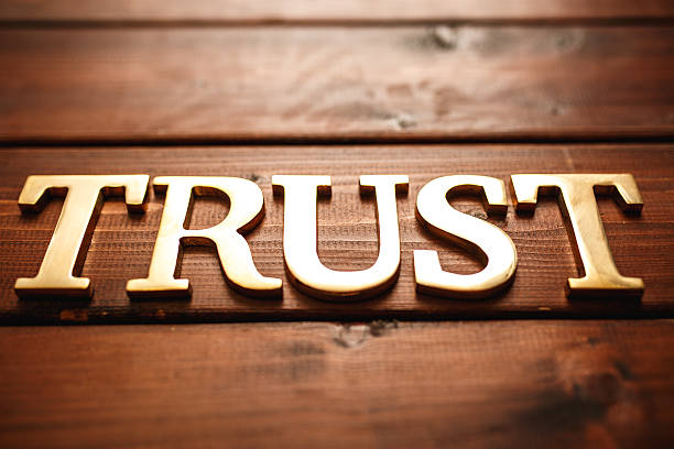 istock Gold text  - trust on wood 492741474