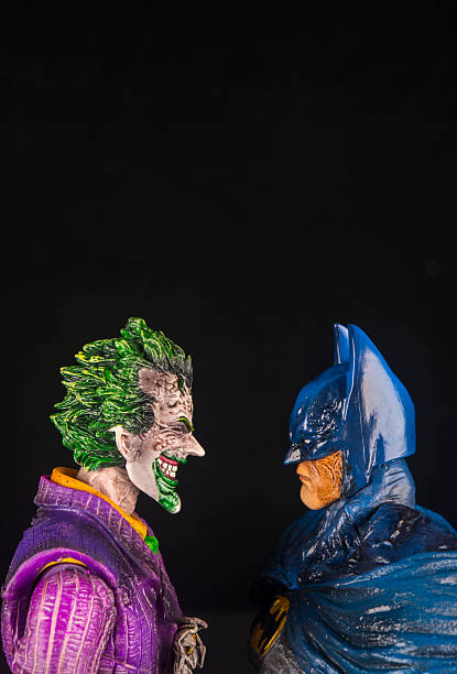 Notre Dame De Lile Perrot, Canada - October15, 2015: Vertical studio shot of the Joker face to face with Batman from DC Comics.