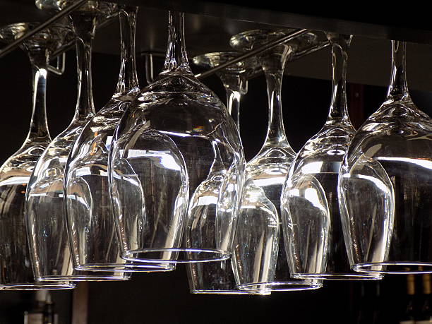 istock Wine glasses on rack in hotel bar 492753304