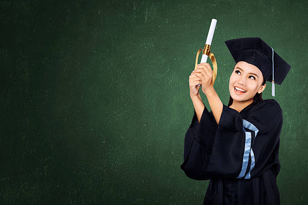 istock Happy graduated student girl with scroll 492753772