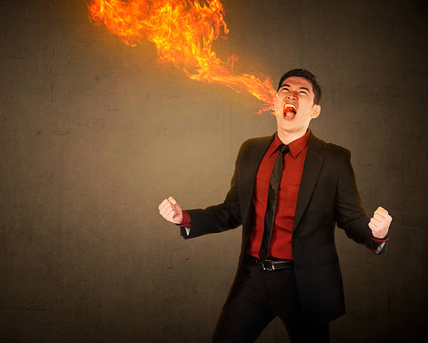 istock Business man having fire breath 492754010