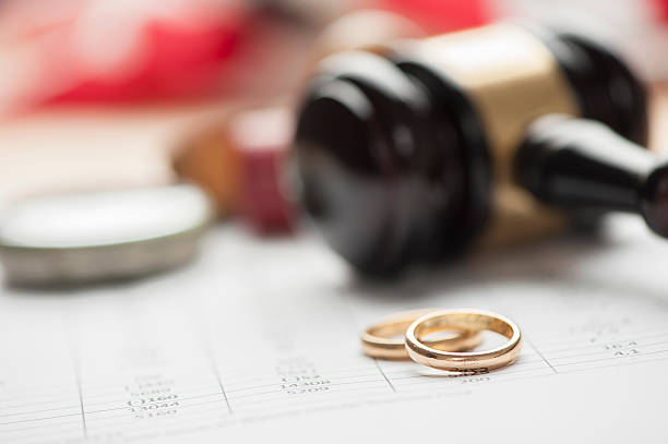 Gavel and wedding rings Gavel and wedding rings for divorce concept civil partnership stock pictures, royalty-free photos & images