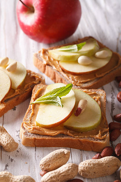 istock Delicious sandwiches with peanut butter and apple vertical 492759338
