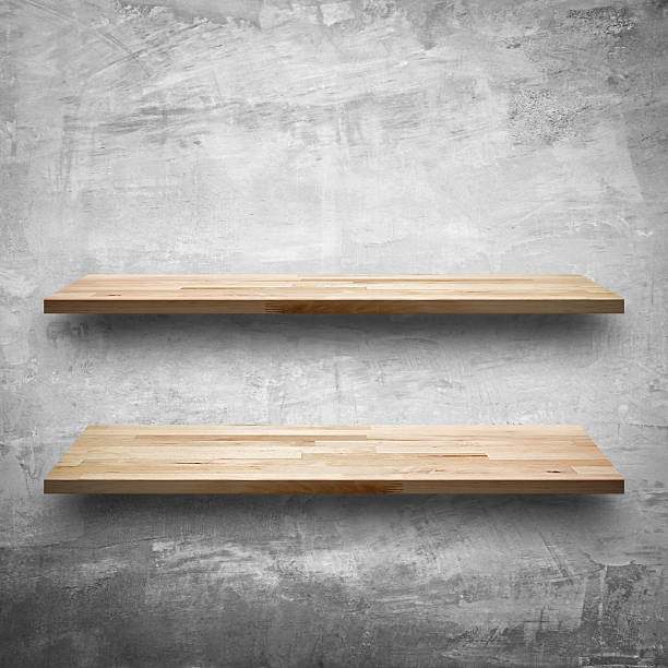 istock Empty wooden shelves on bare concrete wall background 492759996