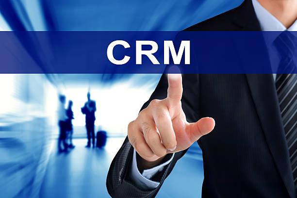 istock Businessman hand touching CRM or (Customer Relationship Management) sign 492761010
