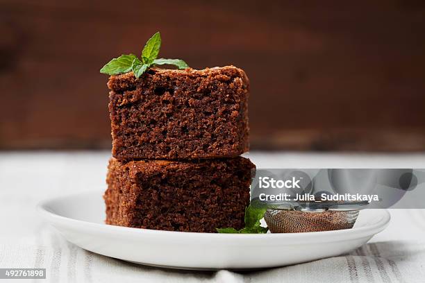 Brownie With Mint Closeup Chocolate Cake Or Pie Dessert Stock Photo - Download Image Now