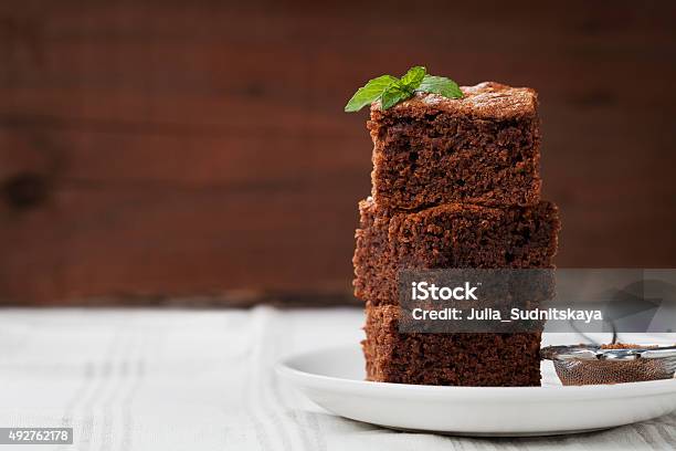 Brownie Chocolate Cake Or Pie Cacao Dessert With Mint Stock Photo - Download Image Now