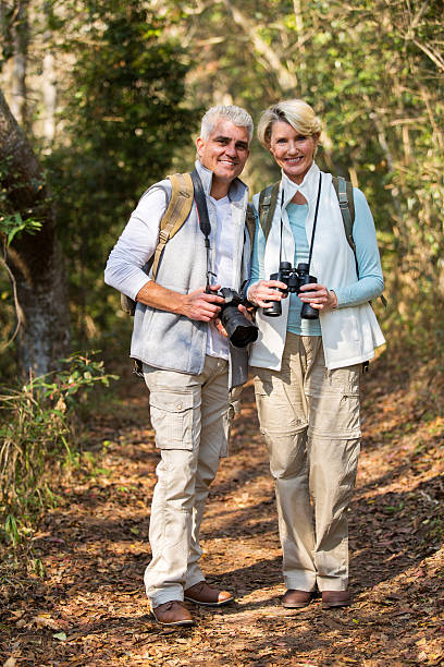 istock old couple standing in the forest 492763780