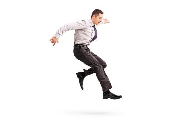 ジャンプ若いビジネスマンの空気 - men businessman jumping levitation ストックフォトと画像
