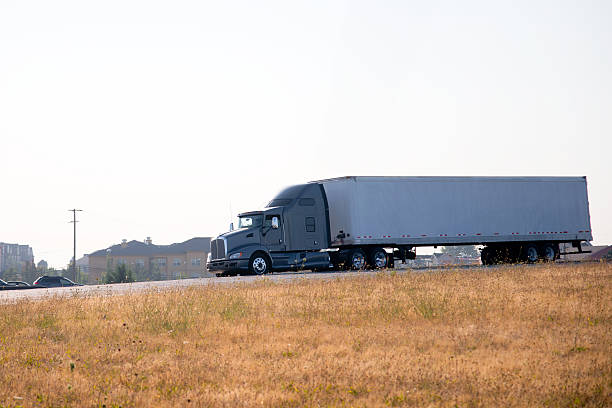 Modern elegant powerful semi truck big rig side view