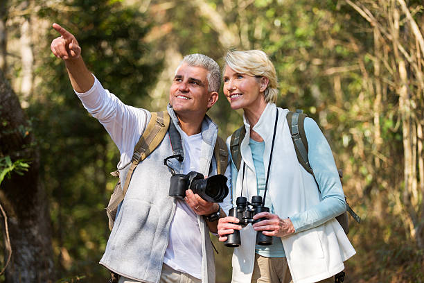istock middle aged couple hiking outdoors in forest 492764452