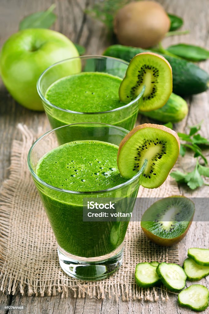 Kiwi and cucumber smoothie Kiwi and cucumber smoothie on rustic table 2015 Stock Photo