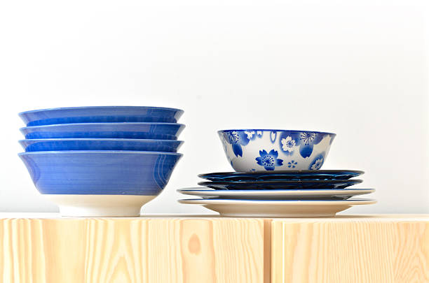 istock Blue and white dishes on the wooden cupboard 492764490