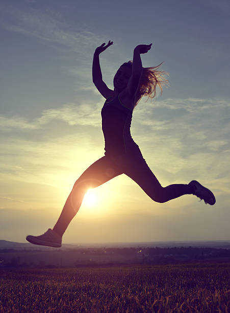 istock Young woman jumping 492764692