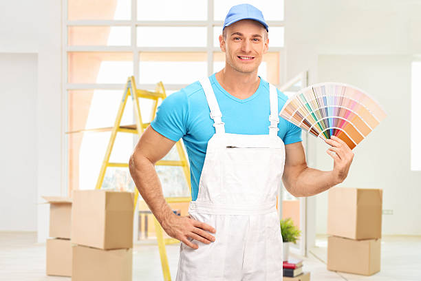 istock Male house painter holding a color swatch 492765004