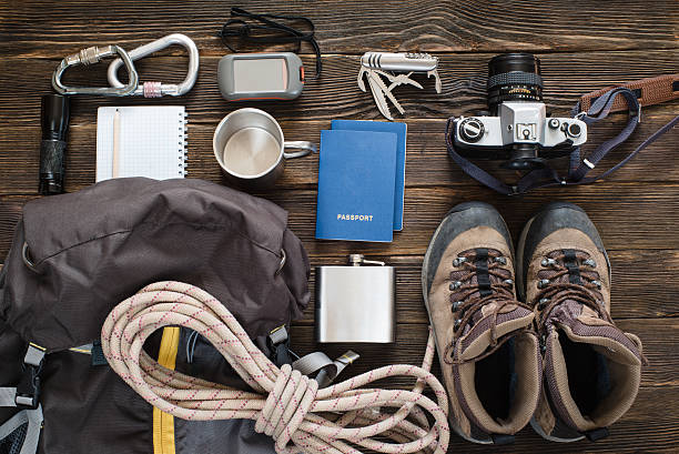 istock Travel items near backpack on the floor for mountain trip 492774670