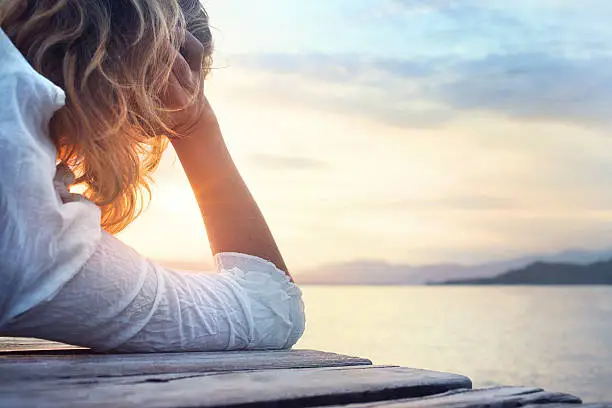 melancony woman observing the sunset