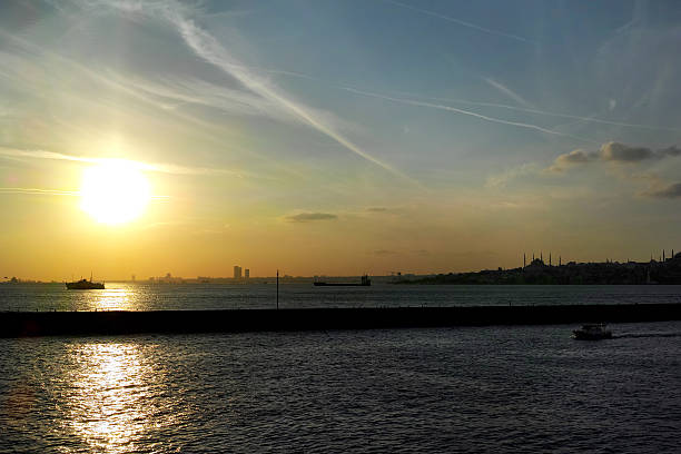 istock Awesome Sky Sun Sea And Plane Trails 492776824