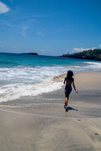 istock Girl runs along the beach 492776978