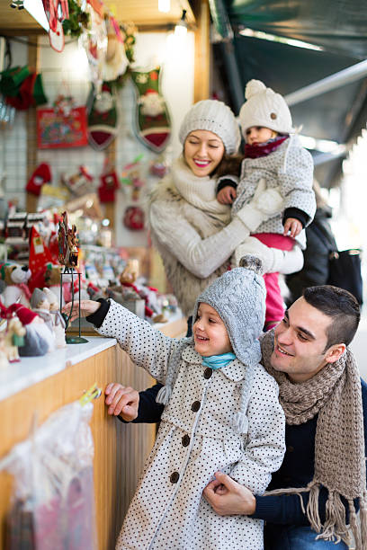 istock parents with kids at  X-mas market 492778070