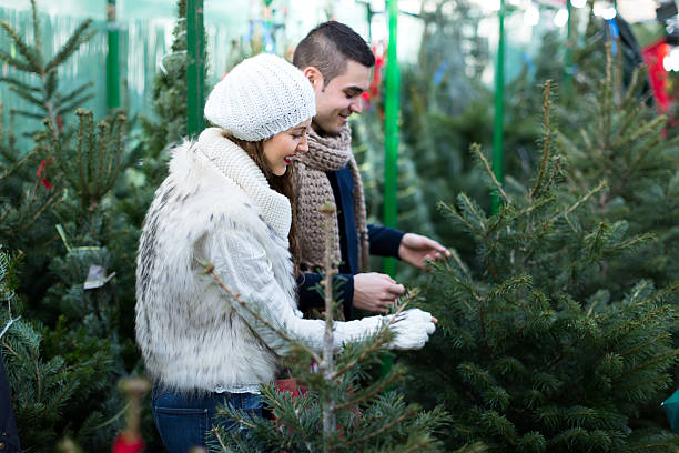 istock Couple buying a christmas tree 492778262