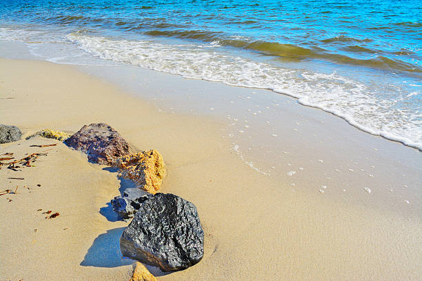 istock rocks by the shore in Sardinia 492778372