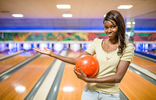 african woman in bowling pub