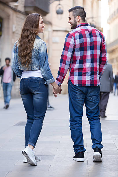 istock Couple walking through  European city 492779056
