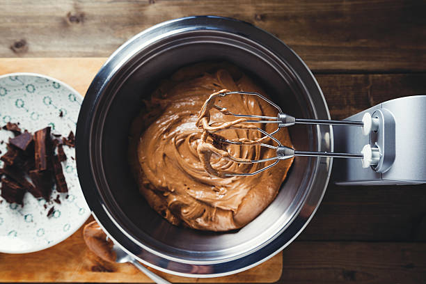 cake dough prepared with mixer in bowl on the table