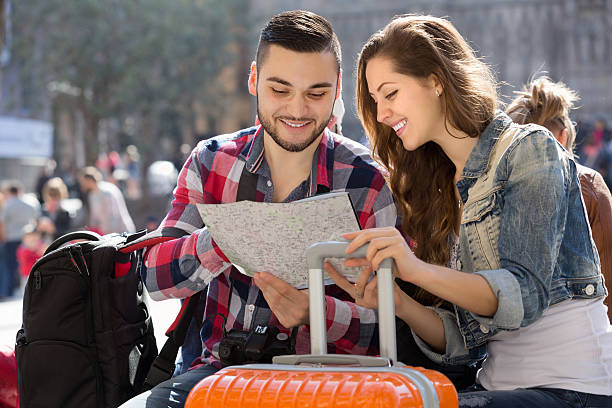 istock Couple with luggage walking 492779168