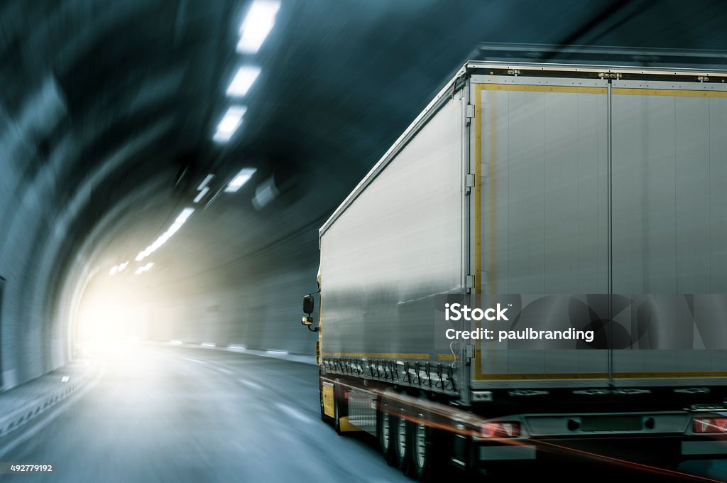 Truck in Tunnel Semi-truck with trailer driving through a tunnel. Semi-Truck Stock Photo