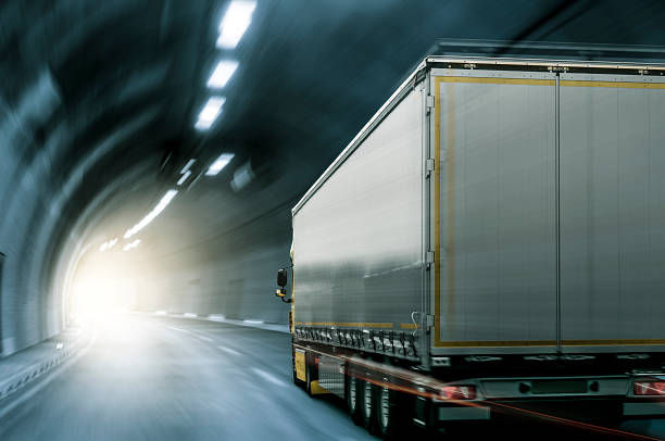 Truck in Tunnel Semi-truck with trailer driving through a tunnel. mercedes argentina stock pictures, royalty-free photos & images