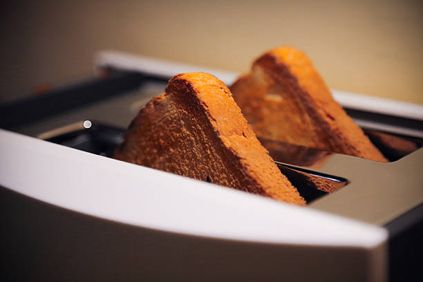 istock Fresh golden toast baked in modern toaster. 492780748