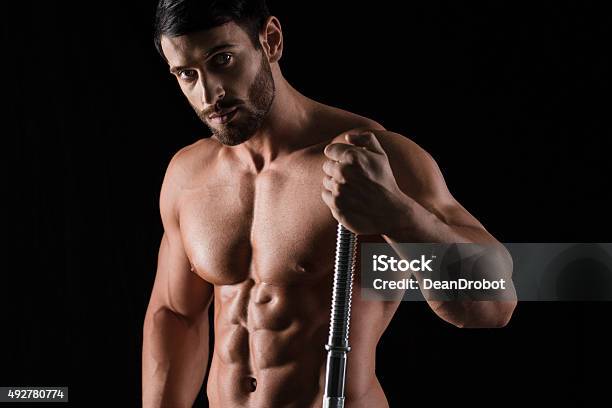 Fitness Muscular Man Holding Barbell Stock Photo - Download Image Now - 2015, Abdominal Muscle, Adult