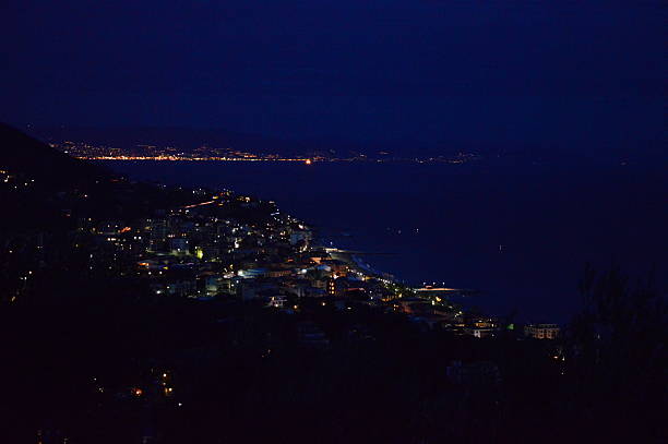 istock View of a town on the coast by night 492781218