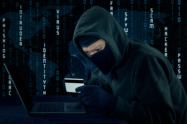 istock Male villain stealing credit card information 492781696