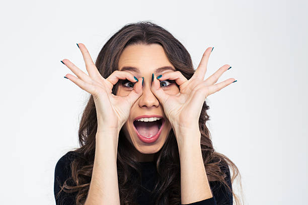 istock Girl looking at camera through fingers 492782200