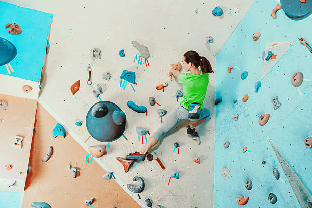 istock Woman exercising in climbing gym 492782210