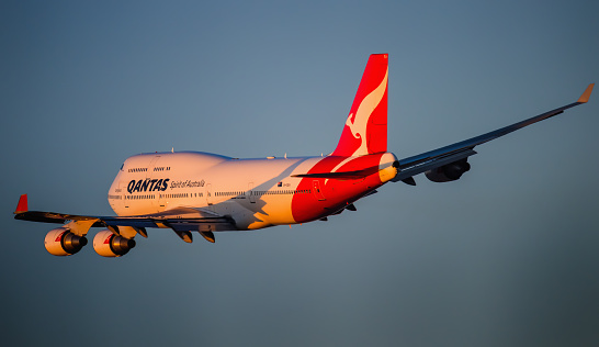 Sydney Australia October 15,  2015  passenger aircraft Boeing 747-400 in Qantas colour scheme taking off from Kingsford Smith airport, The plane is bound for America.