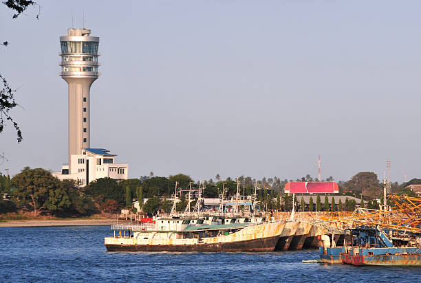 Dar es Salaam, Tanzania: fishing harbor and the maritime control tower - Kivukoni road - seen from the sea - photo by M.Torres