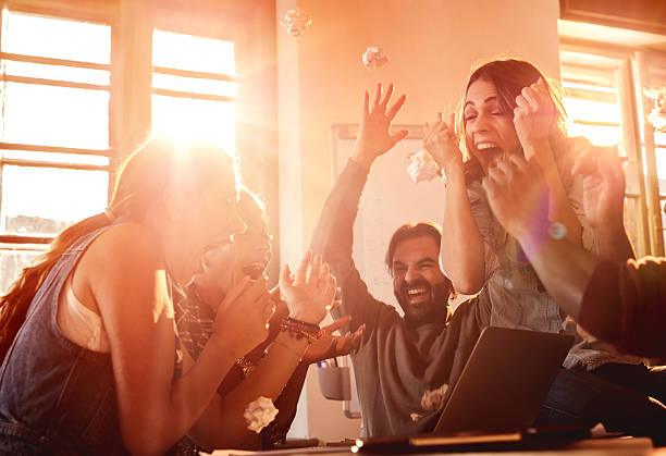istock Excited business team celebrating their success at office. 492785970