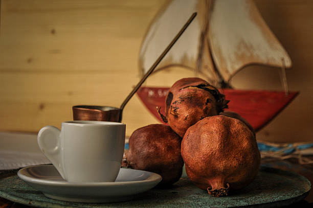 greek coffee and pomegranate in atmospheric light