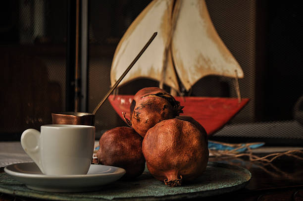 greek coffee and pomegranate in atmospheric light