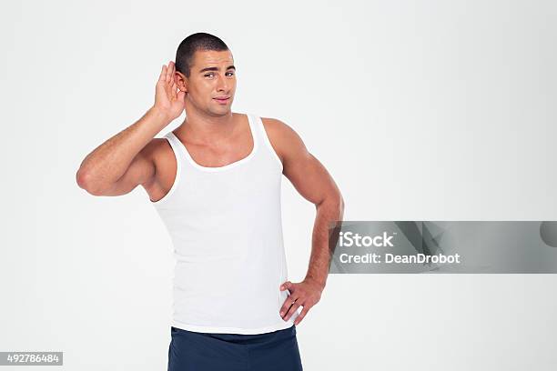 Man Holding His Hand Near His Ear To Listening Something Stock Photo - Download Image Now