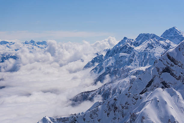 istock View on mountains and blue sky above clouds, Krasnaya Polyana 492788150