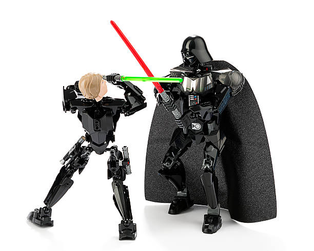 Ankara, Turkey - October 13, 2015:  New Lego Star Wars Darth Vader and Luke Skywalker are fighting with sword isolated on white background. 