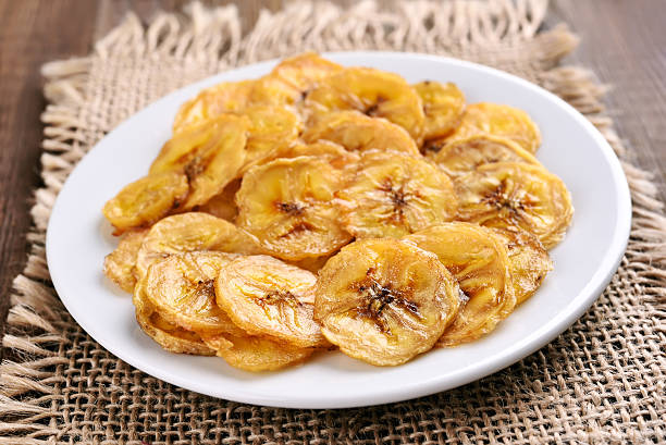 istock Banana chips on country table 492789016