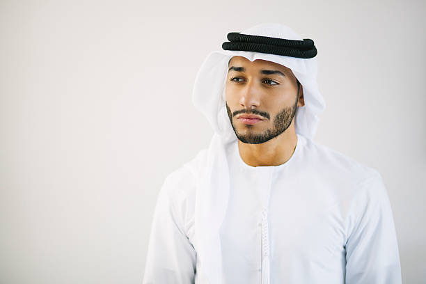 istock Thoughtful Young Emirati Man In Front of White Wall 492789102
