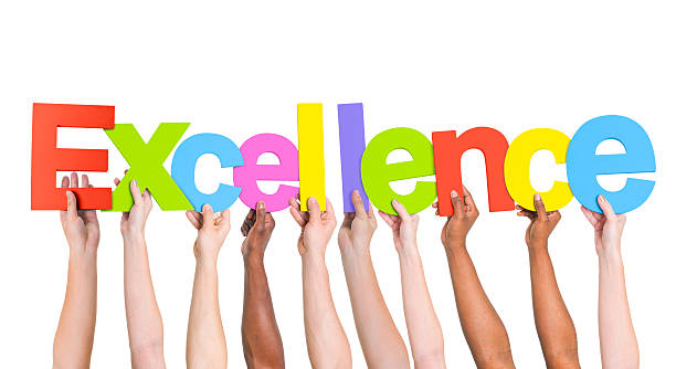 istock Multiethnic Arms Raised Holding Text Excellence 492794195